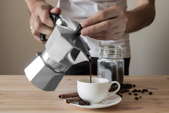 Pouring Coffee Out Of Italian Coffee Pot