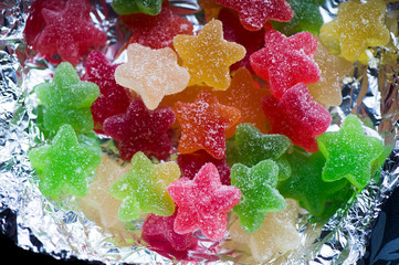 Jujube in sugar absebce star-shaped, colorful. Close