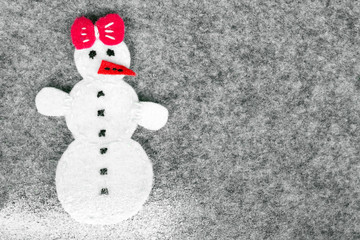 Christmas background with felt decoration: snowman girl