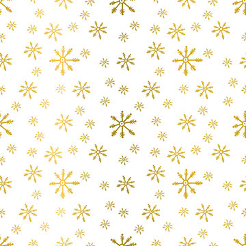 Vector seamless winter pattern background with gold snowflakes.