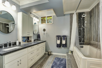 Basement bathroom interior in gray and white tones
