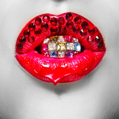Close up picture of macro red beautiful lips with red beads. Ton