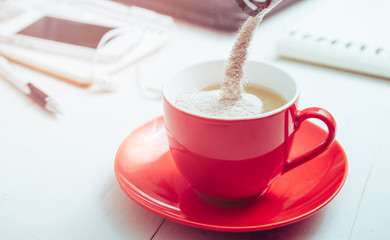 instant coffee mixed 3 in 1 is pouring into a coffee cup.