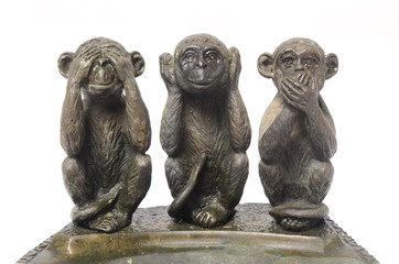 Fototapeta na wymiar Three Monkeys Sculpture Hear Speak see