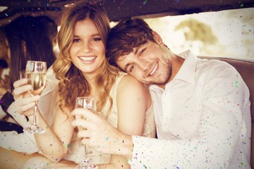 Composite image of portrait of couple holding champagne © vectorfusionart