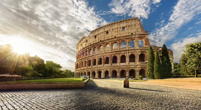 Fototapeta Colosseum in Rome and morning sun, Italy