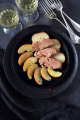 Fried  foie gras with apples and two glasses of white wine