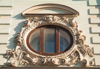 Window with stucco molding old house in Art Nouveau style
