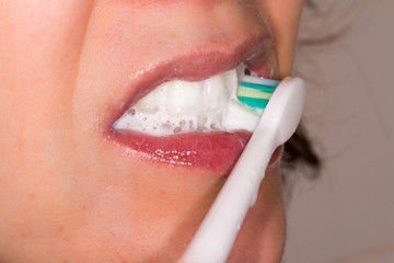 Woman brushing teeth 