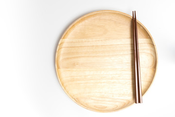 Wooden plate or tray with chopsticks isolated on white background
