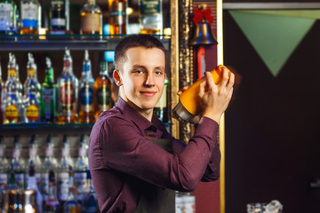 The bartender making cocktail