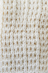 The texture of the white wool knit. Close