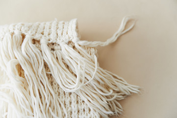 warm White knit scarf with tassels. Close
