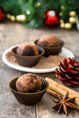 Christmas chocolate truffles on wooden table

