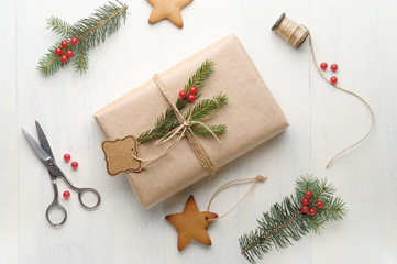 Christmas gift, thread, scissors, pine cone, pine needles.