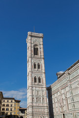 People standing on top of Giotto’s Campanile Bell Tower, part of Florence Cathedral on the Piazza...