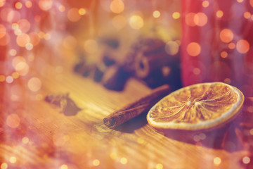 cinnamon, anise and dried orange on wooden board