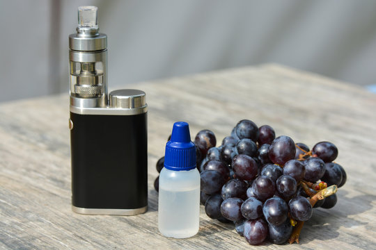Electronic cigarette and liquid for her.Black grapes.