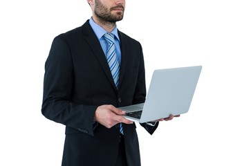 Businessman holding laptop