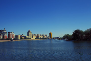Fototapeta na wymiar One of the embankments of the river Ishim in Astana