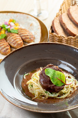 grilled beef fillet pieces on noodles