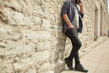 close up of man calling on smartphone in city