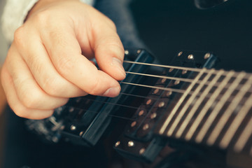 man playing electric guitar © fotofabrika