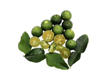 Cut limes and green leaves on white background.
