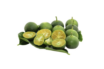 Cut limes and green leaves on white background.