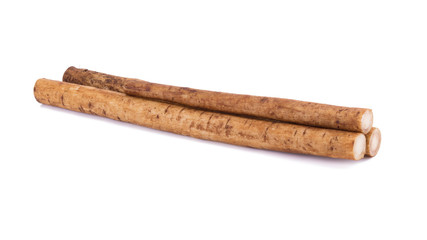 Fresh Burdock roots on white background.
