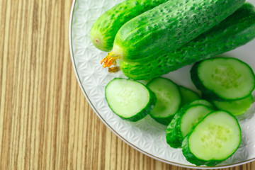  cucumbers on wooden background