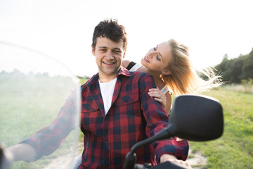 Couple in love enjoying a quad bike ride in countryside.