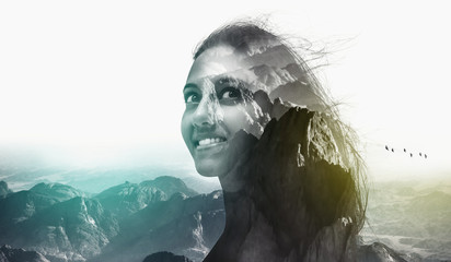 Double exposure portrait of a woman and moutains