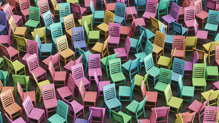 Chaotic Array of Colorfully Stained Wooden Chairs Facing Random Directions