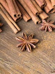 cinnamon sticks and  star anise on wooden background