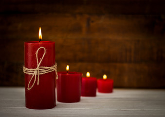 Red candles on wooden floor,Festive or spa concept ideas background
