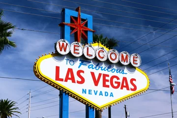 Poster The Welcome to Fabulous Las Vegas sign on bright sunny day in Las Vegas.Welcome to Never Sleep city Las Vegas, Nevada Sign with the heart of Las Vegas scene in the background. © AmeriCantaro