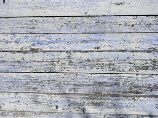 Old wooden background from the remains of paint and traces of use