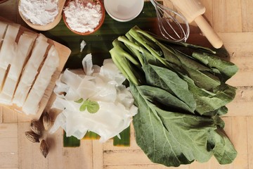 Making rice noodle flat on wood background.