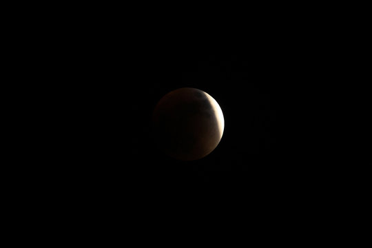 Partial before total lunar eclipse 2015, also known as blood moon, photographed sep 27th, 8-11 pm, in the mountains of Colombia at 3'560 mabsl, national park Cocuy. - Powered by Adobe