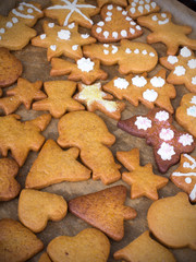 Colorful Christmas gingerbread cookies on  baking paper