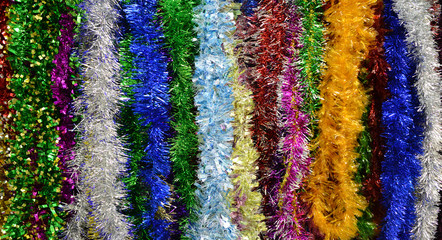 Christmas tinsel, partly out of focus, focus on the center of th