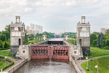 View on canal with closed shipping lock against skyline. Moscow, Russia. 
