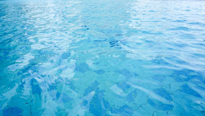 Swimming pool water surface background or texture