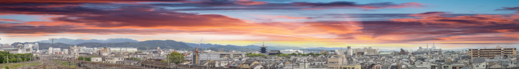 Fototapeta na wymiar Sunset over Kyoto, Japan. Aerial panoramic city view