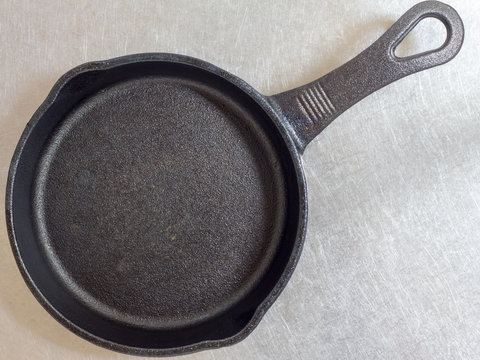 Cast iron skillet on stainless table