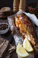 Fried fish with spices and lemon