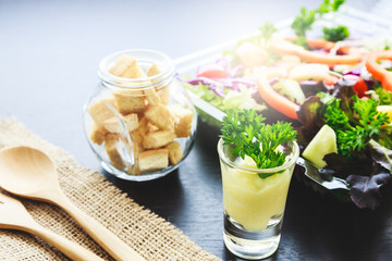 Crispy bread, Kiwi sauce and mix salad with fruit and vegetable