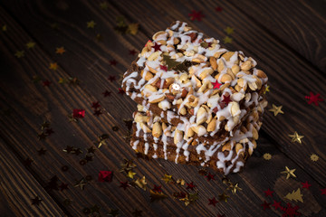 piece of cake, cookies with nuts and white icing, Christmas star