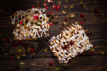 piece of cake, cookies with nuts and white icing, Christmas star